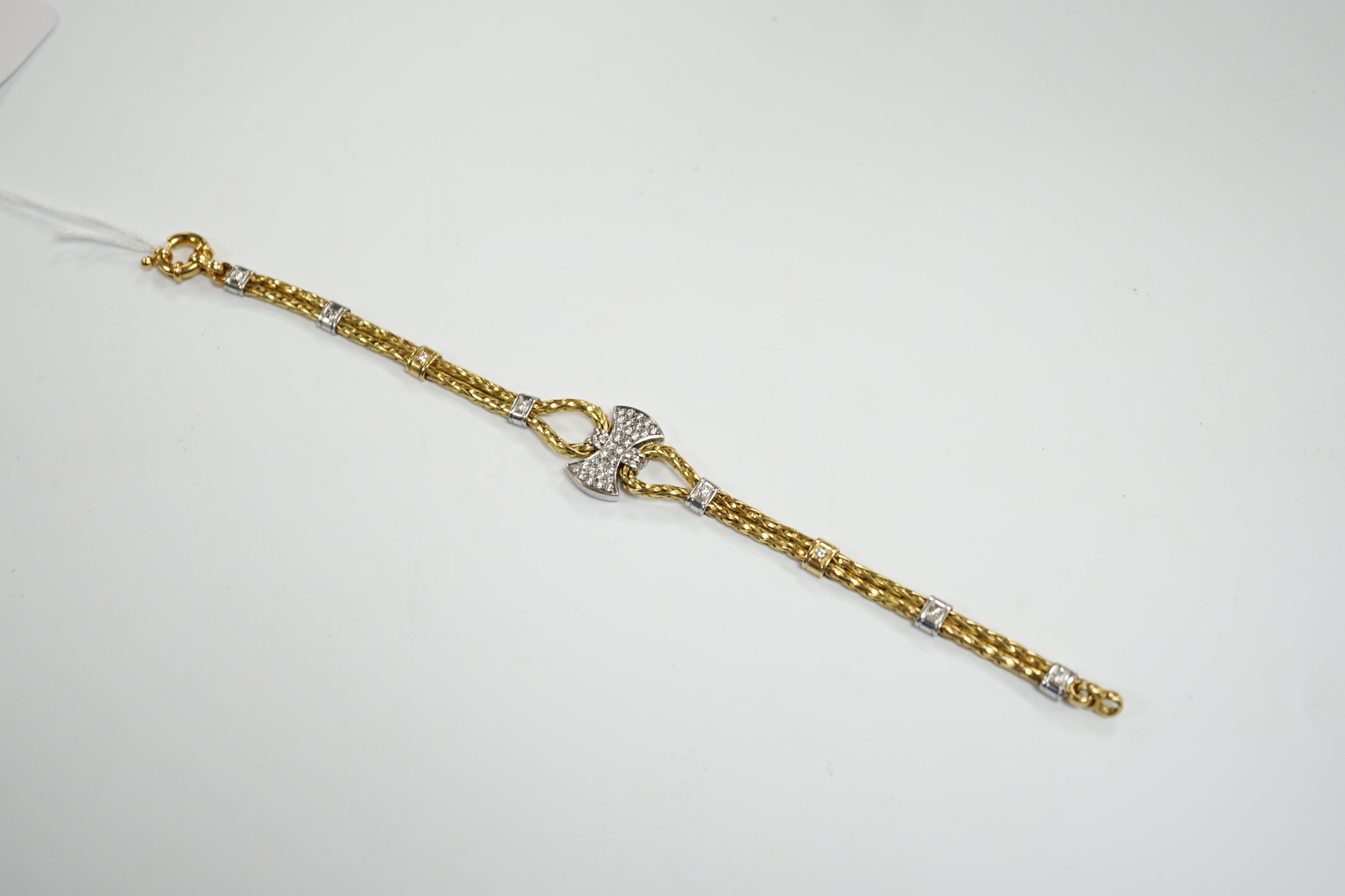 A modern 750 yellow metal and diamond cluster set bracelet, 21.5cm, gross weight 33.9 grams.